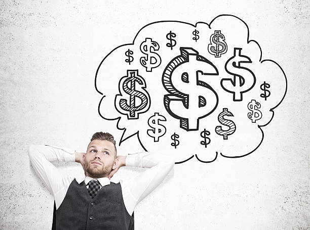Relaxing businessman daydreaming about money on concrete background with dollar sign sketch inside thought cloud. Financial growth concept